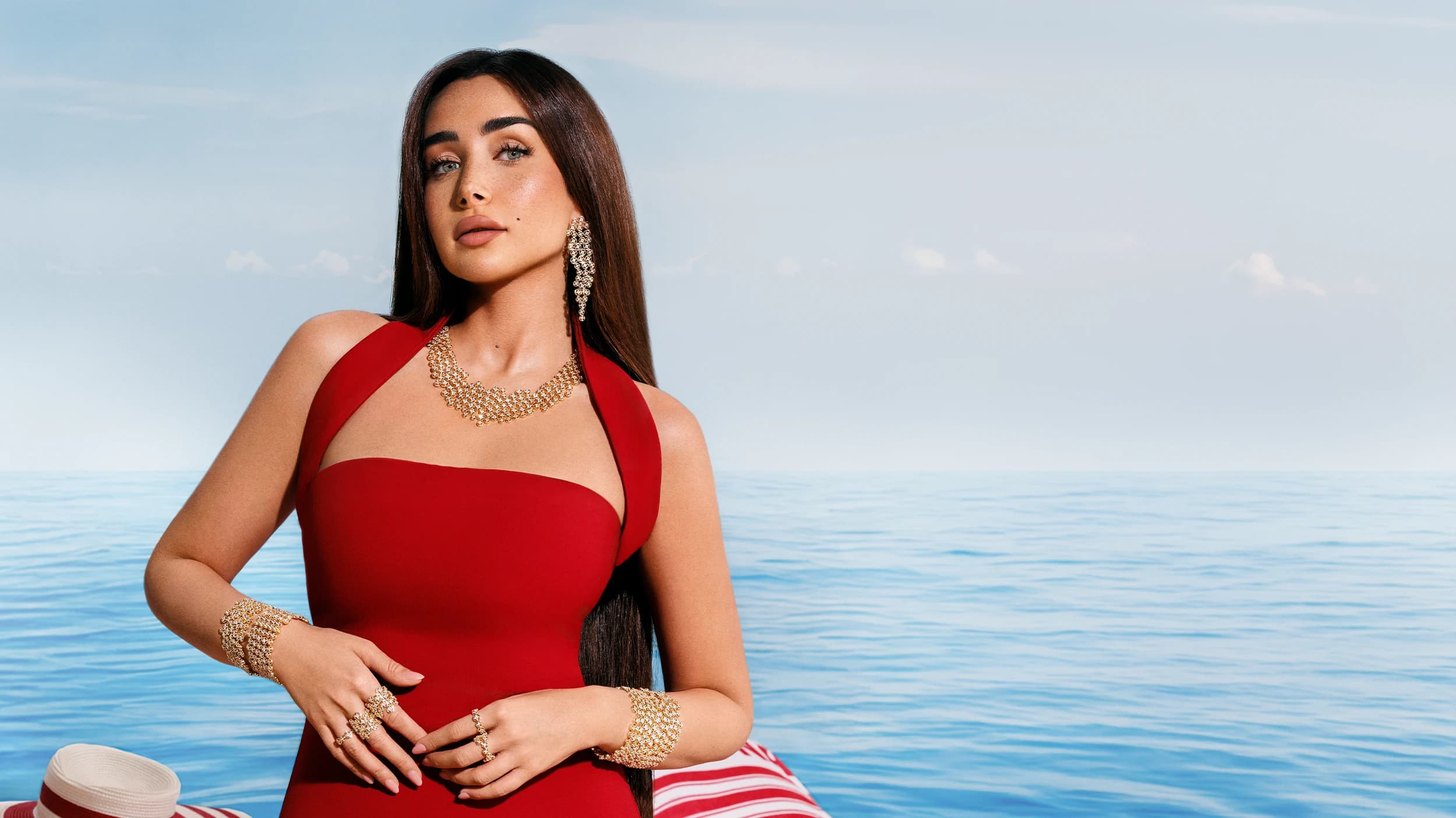 APM Monaco Été campaign, gold jewellery worn against the Mediterranean
