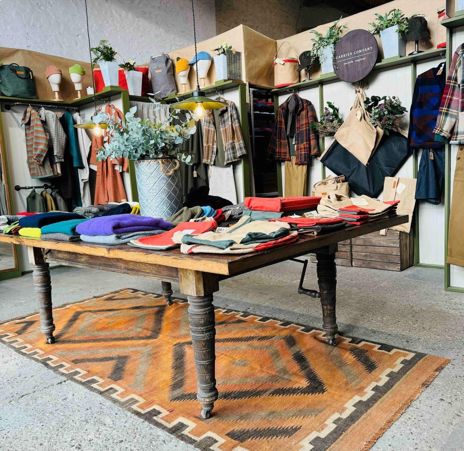 Inside the Carrier Company shop in Norfolk, knitwear laid out on a table