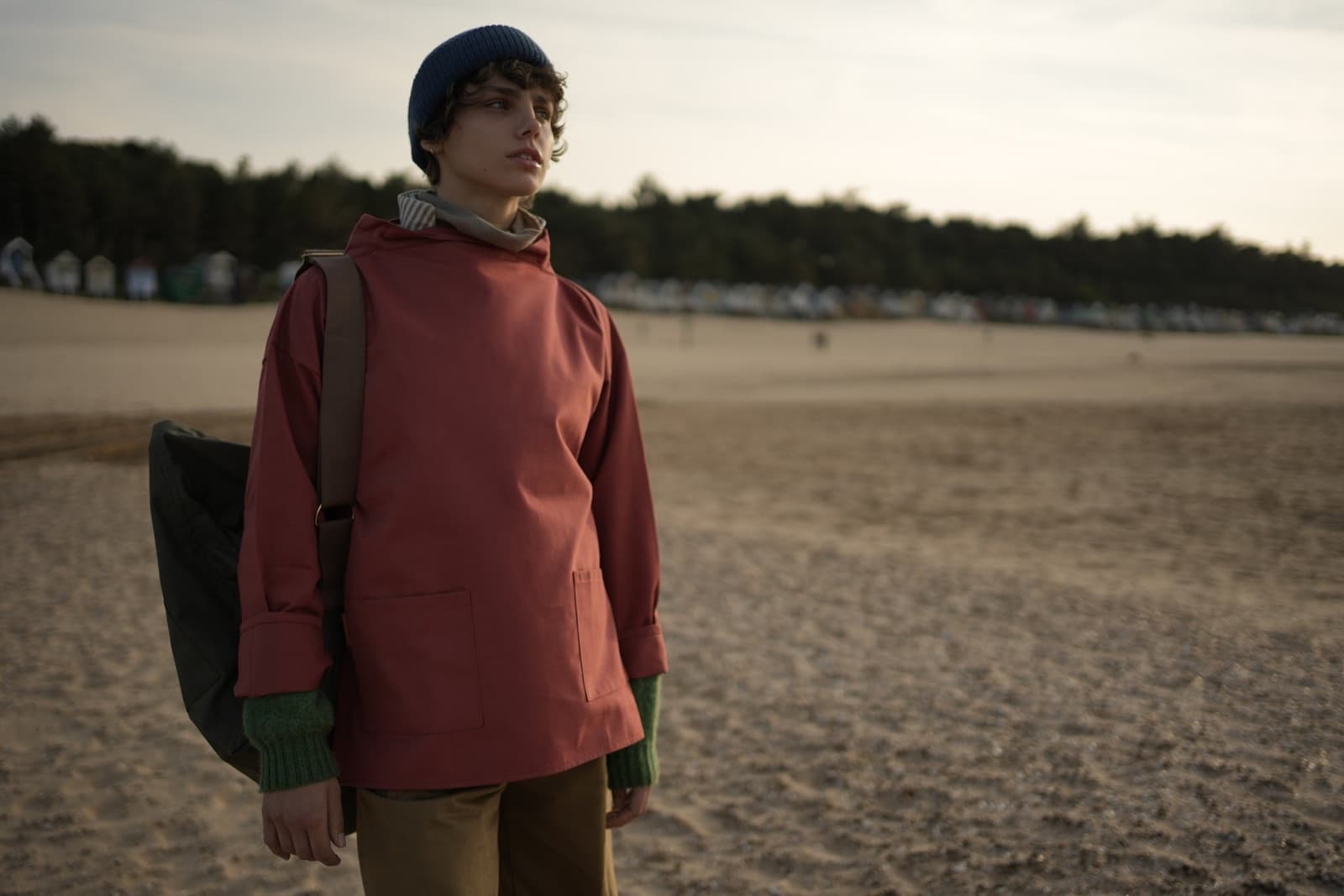 A child in a Carrier Company smock on a Norfolk beach