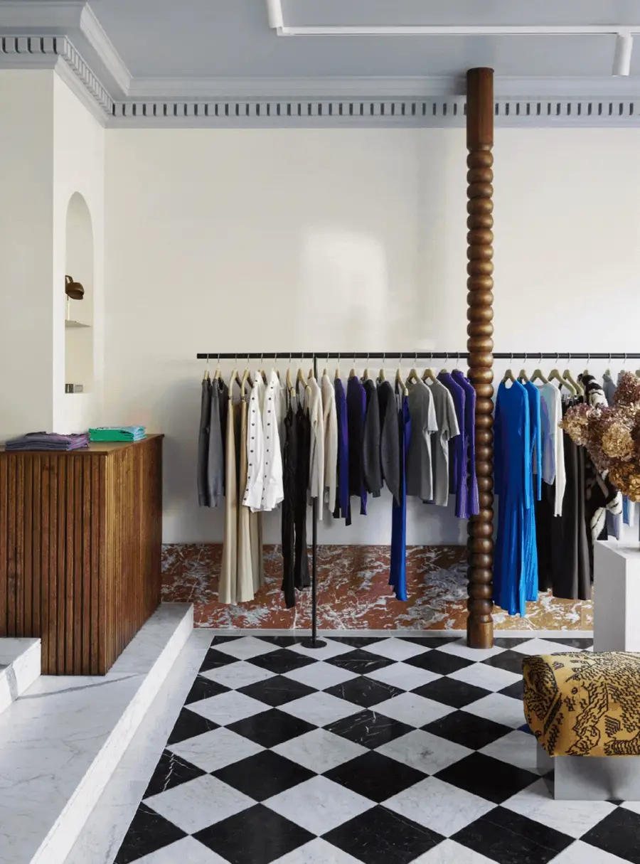 A clothing rail against a black and white checkerboard floor at Grace Armadale