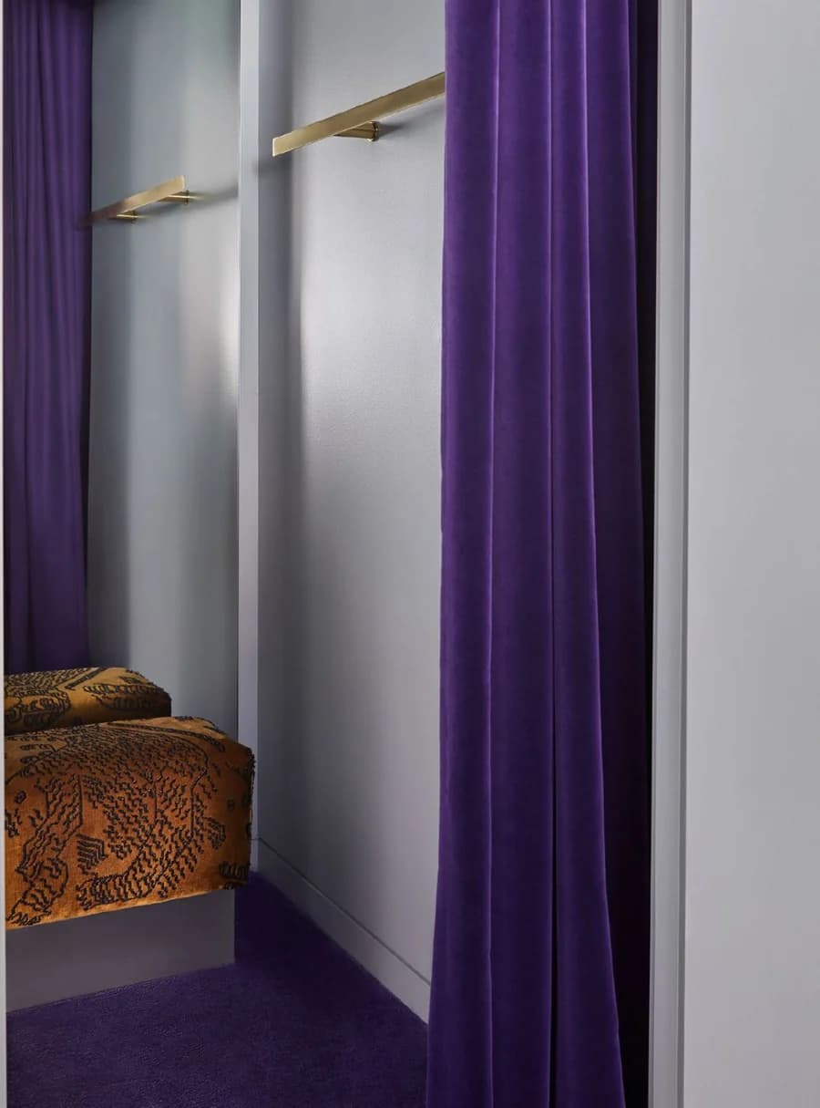 A fitting room with purple velvet curtains at Grace Armadale