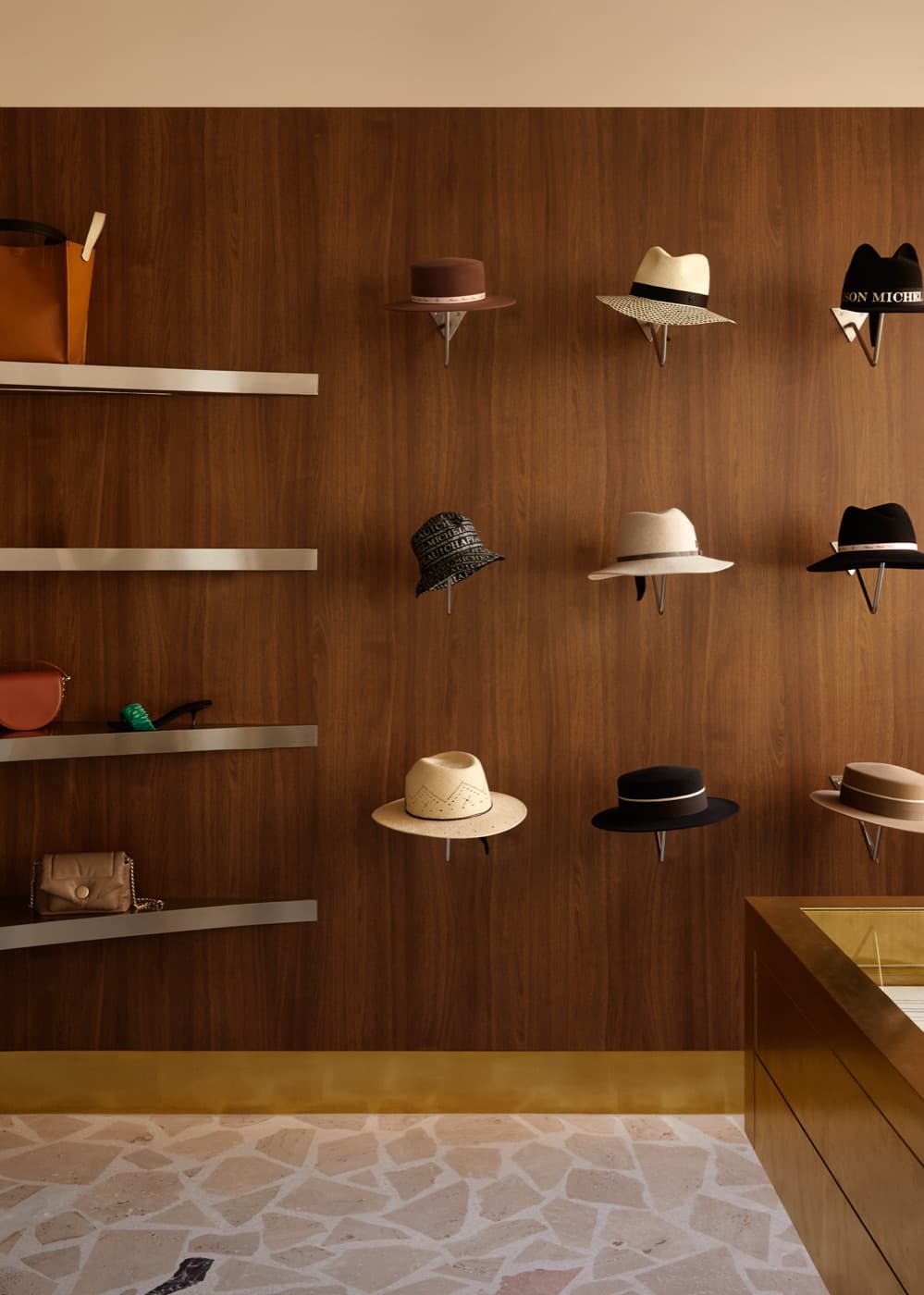 A wall of designer hats on display at Grace Brighton
