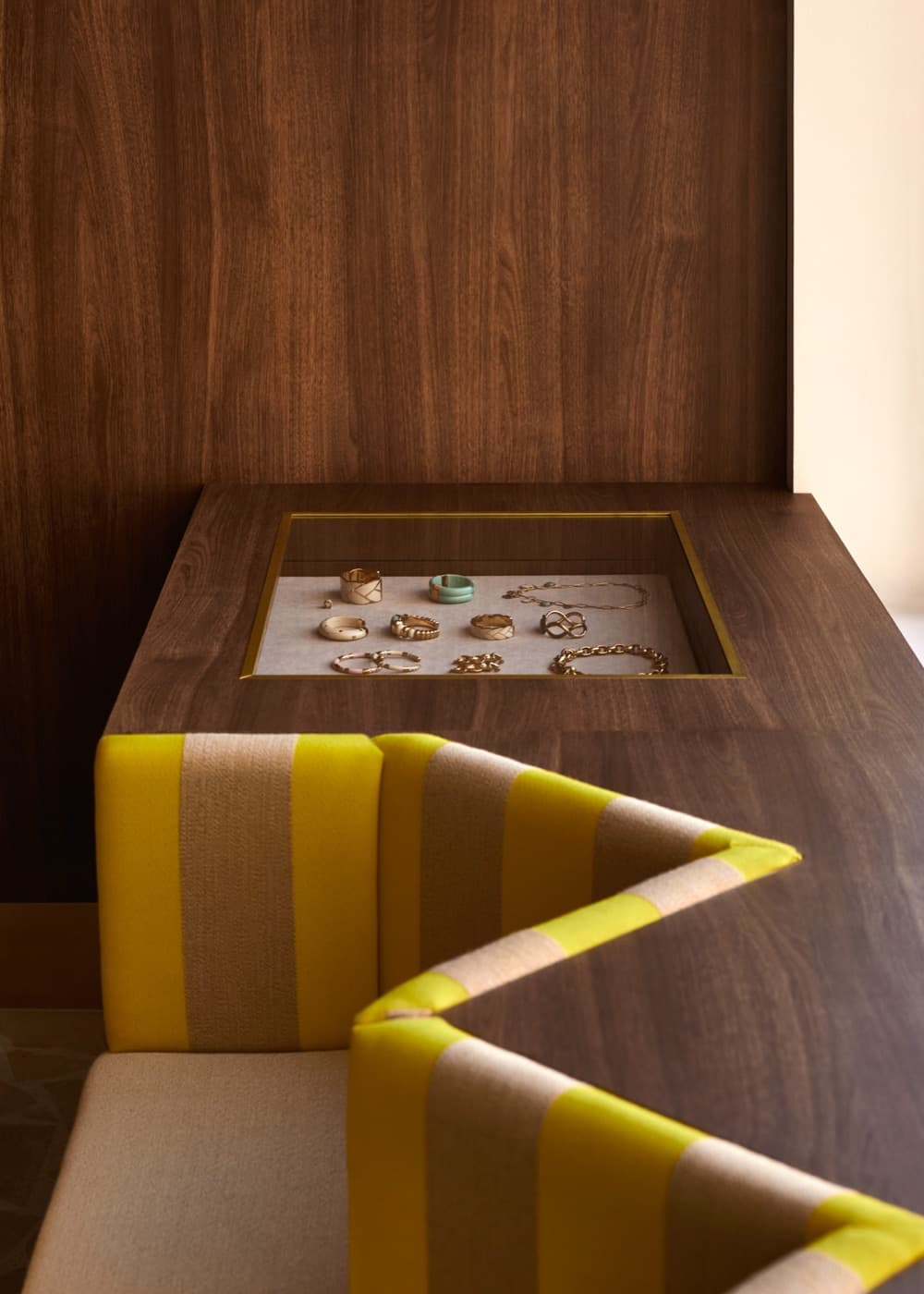 A brass jewellery case with rings and bracelets at Grace Brighton