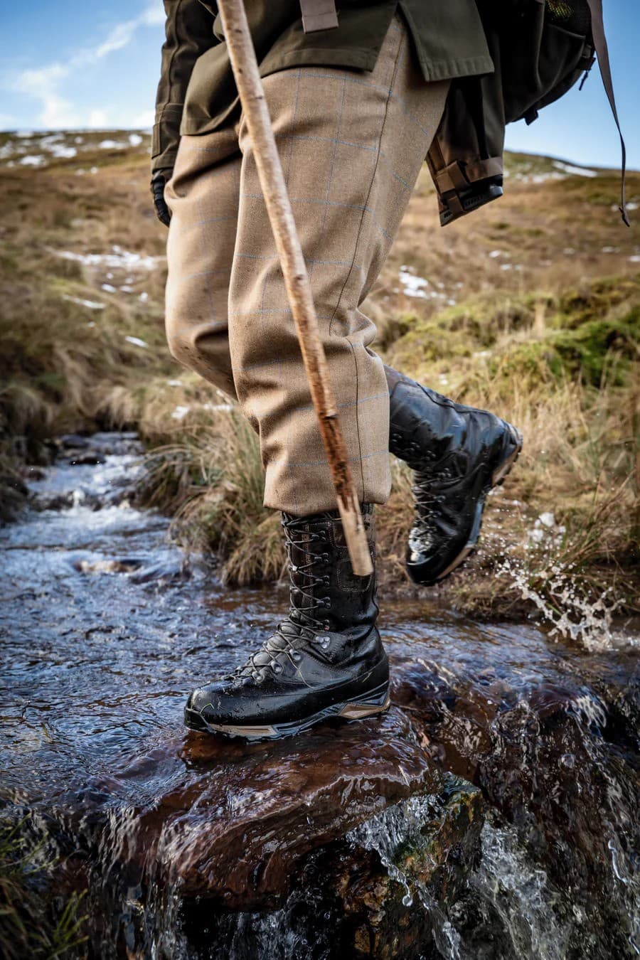 Le Chameau boots crossing a stream on the moor