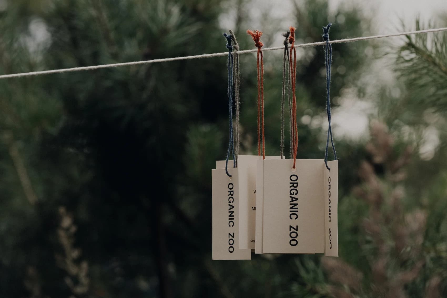 Organic Zoo garment tags hanging outdoors