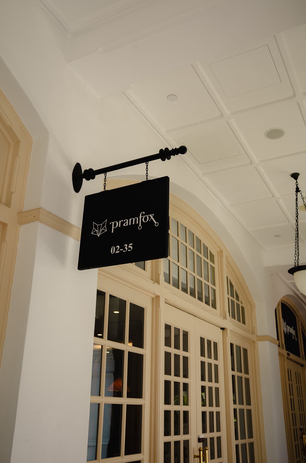 The Pramfox sign outside the store at Raffles Hotel Arcade