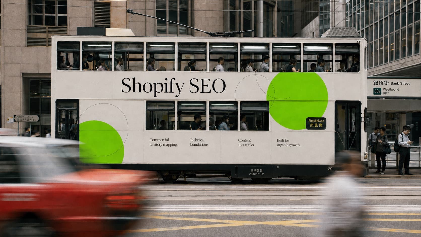 A Hong Kong double-decker tram carrying a Shopify SEO livery passes the Bank Street stop