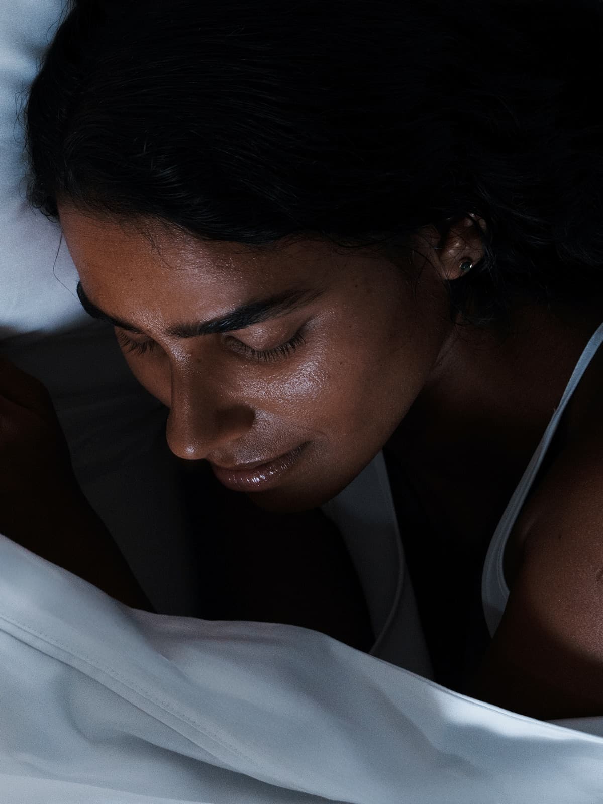 A woman asleep, from a This Works sleep campaign