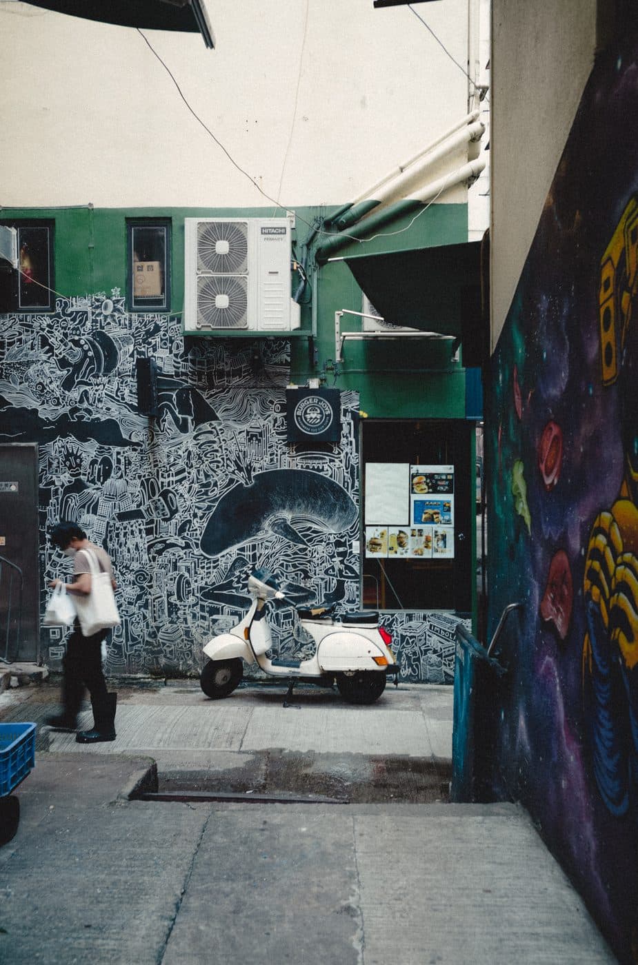 A Vespa parked in a Hong Kong alley